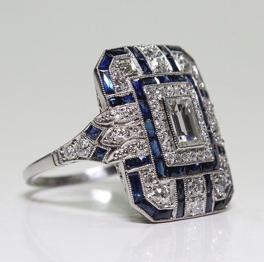 Bague vintage en argent poli avec zircon bleu